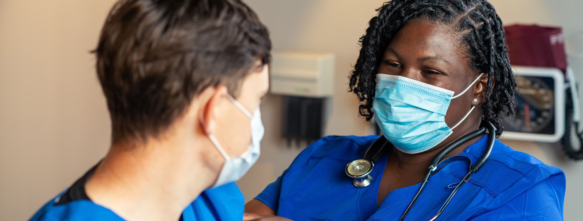 Two nurses reviewing patient information together